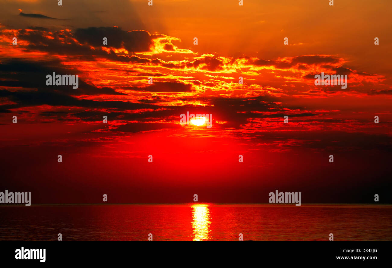 Sunset on the sea with clouds Stock Photo