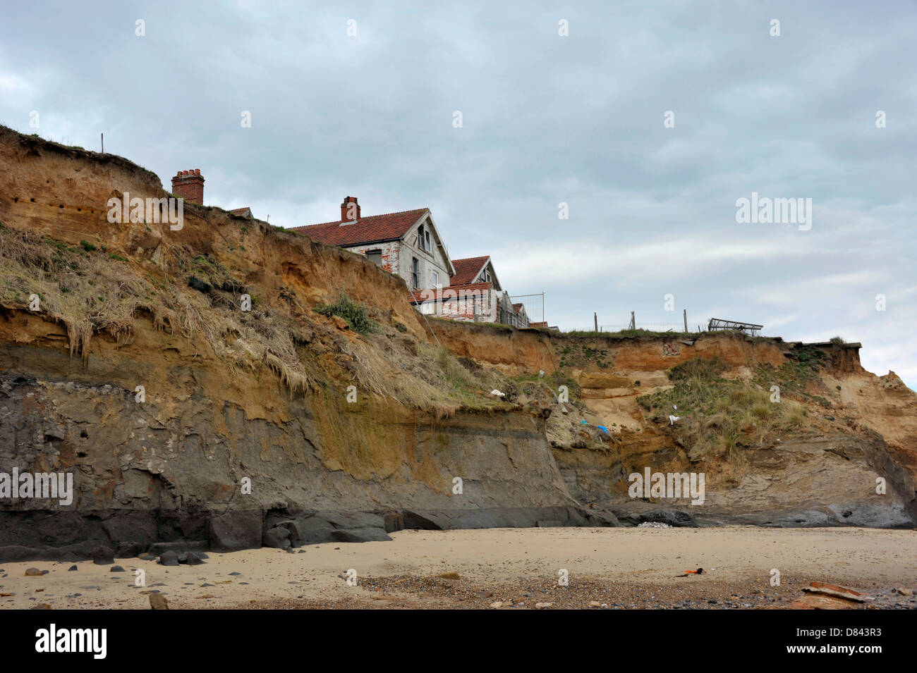 Homes on the cliff edge at Happisburgh in Norfolk demonstrating levels ...