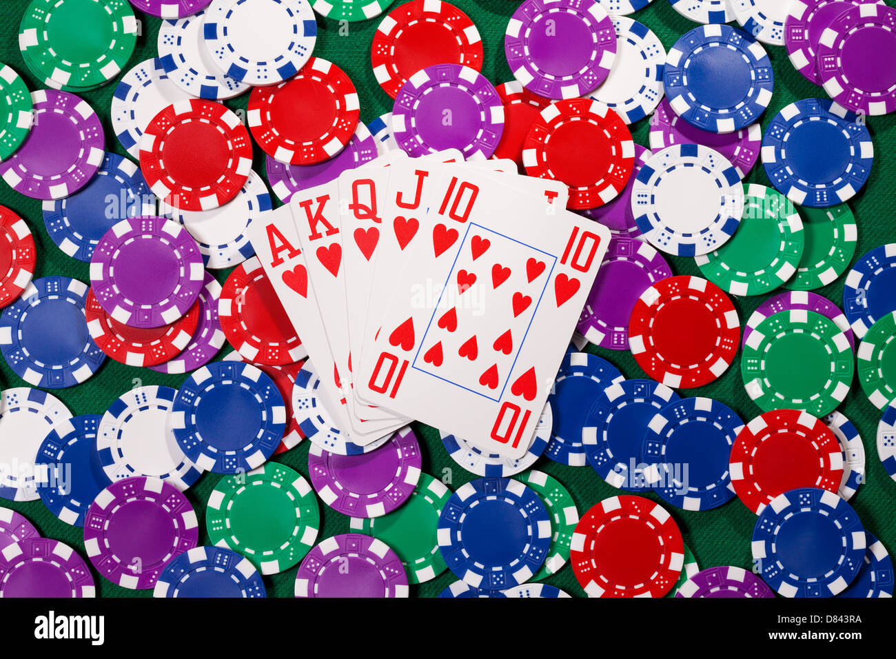 Poker chips and cards closeup on green cloth Stock Photo