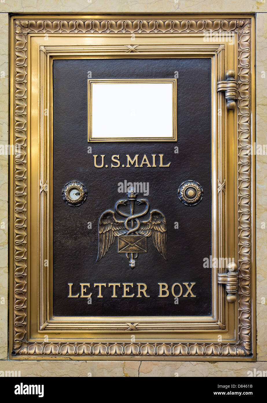 Antique Brass US Mail Letter Box in Historic Building Stock Photo