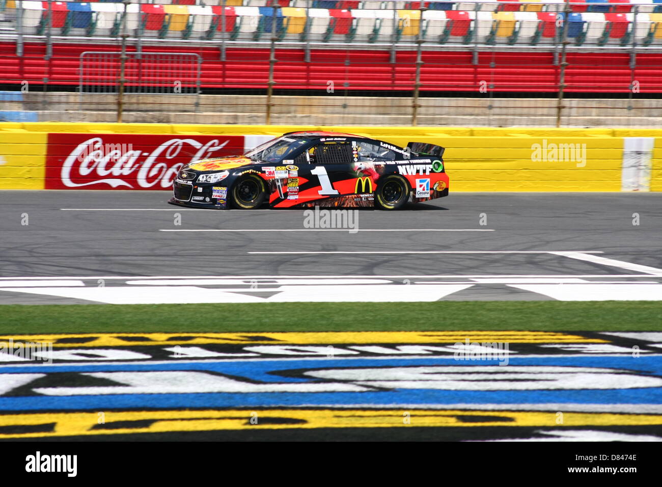 Charlotte, USA. 17th May, 2013. Jamie McMurray passes the grandstand ...