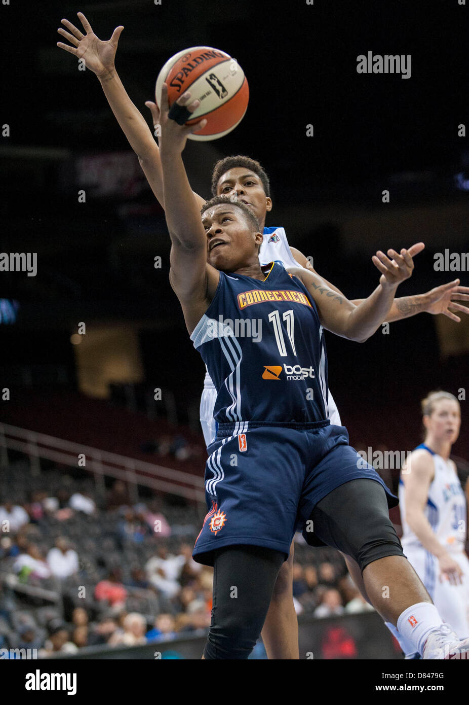 May 18, 2013 - Newark, New Jersey, U.S. - Sun's guard Natasha Lacy #11 penetrates toward the basket as Liberty's guard Kamiko Williams #4 defends in the second half during WNBA action at the Prudential Center in Newark, NJ. New York Liberty defeated the Connecticut Sun 78-67. Stock Photo