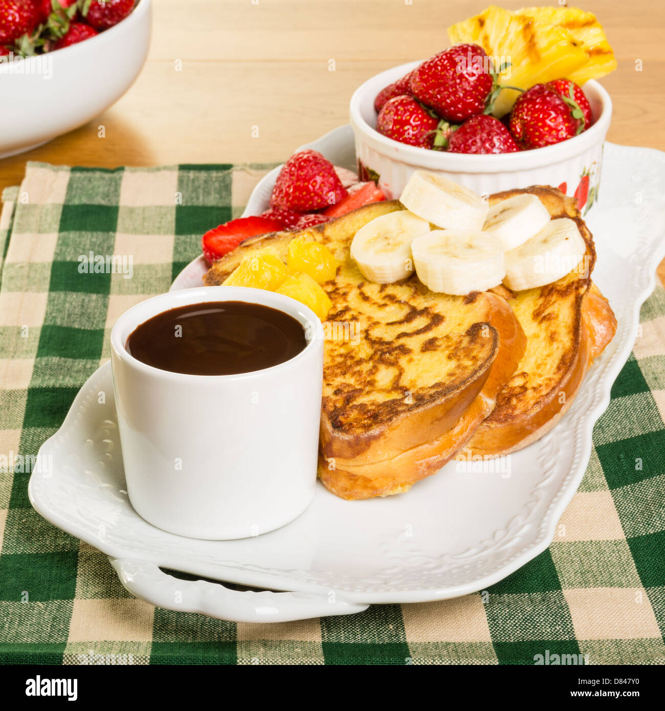 French toast with strawberries pineapple bananas and coffee Stock Photo Alamy