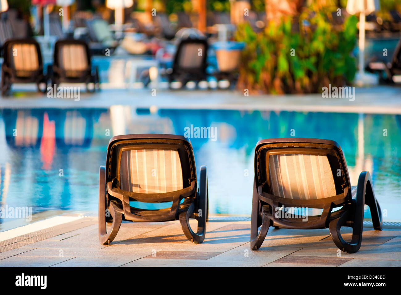 Chaise lounge by the pool to relax in the villa Stock Photo Alamy