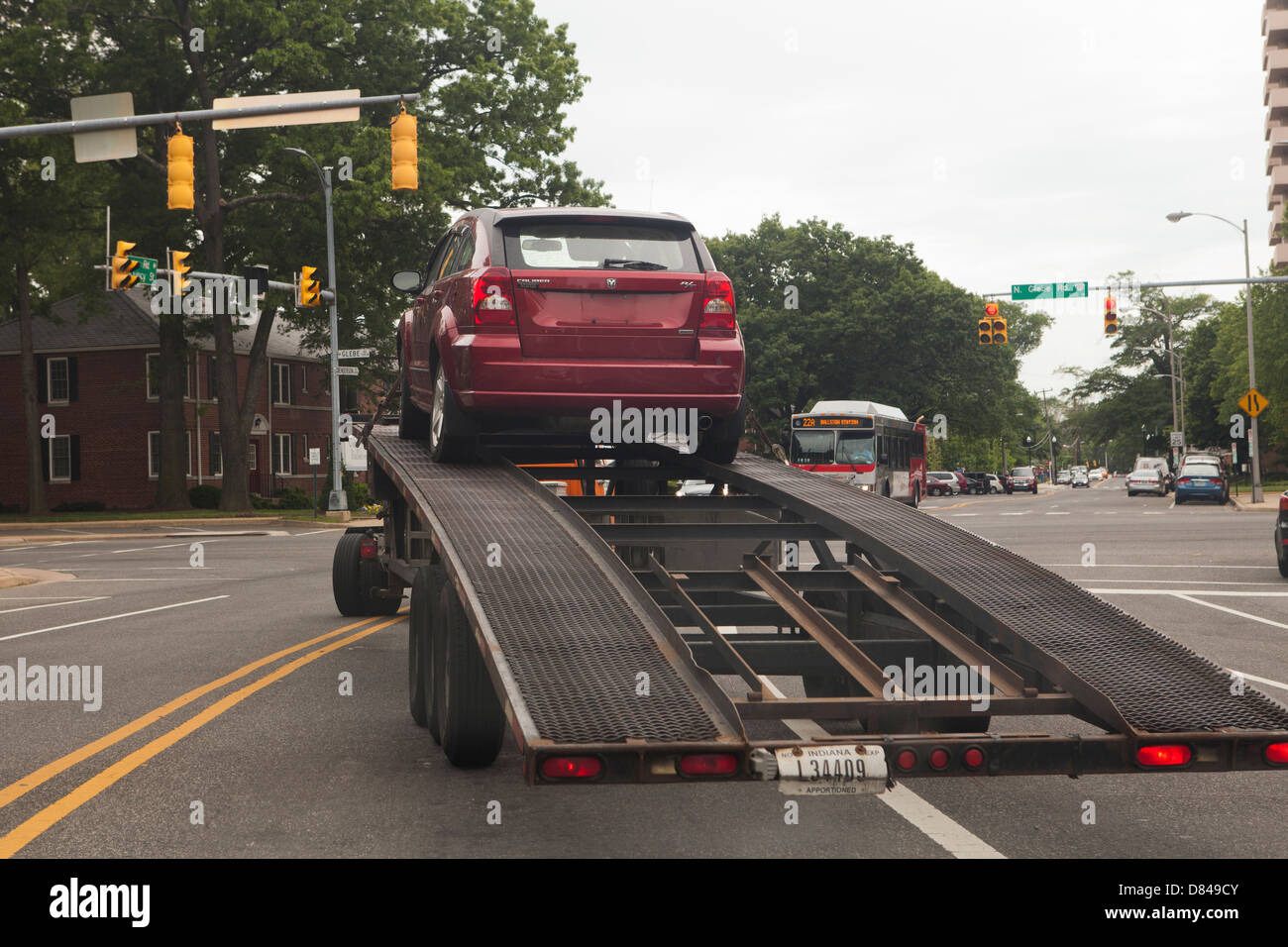 Car being towed away on towing trailer Stock Photo