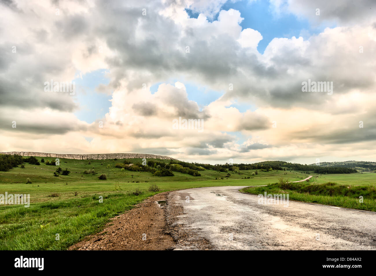 asphalt road and cloudy sky on a mountain plateau Stock Photo - Alamy