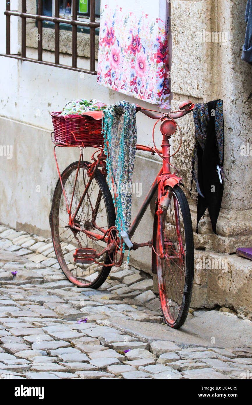 Old Cycle outside shop in Obidos, Portugal Stock Photo