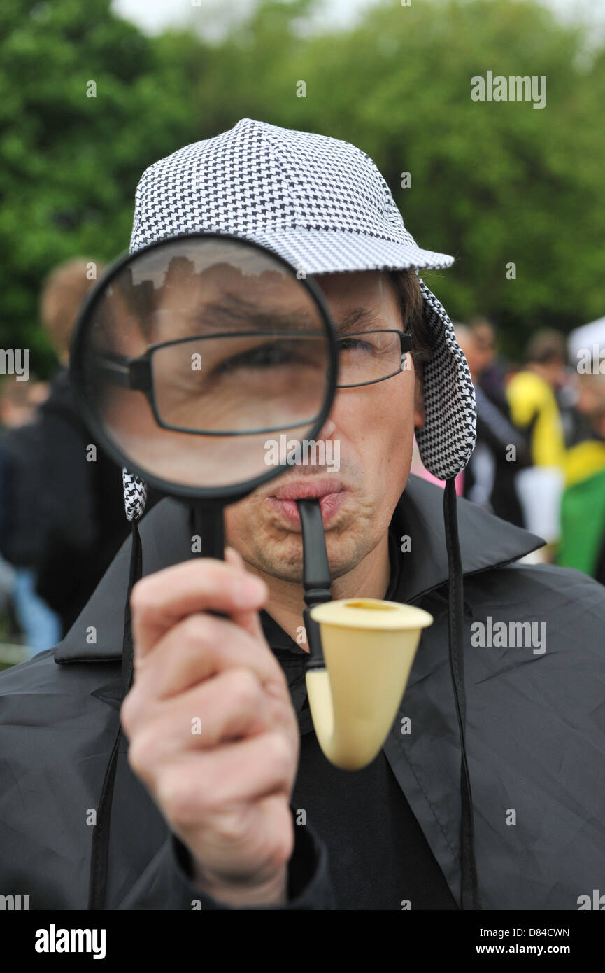 Regents Park, London, UK. 19th May 2013. Sherlock Holmes running for the Independent Age charity at the charity Super Hero fun run in Regents Park. Super Hero Fun Run through Regents Park, runners dressed as superheroes run 5k and 10k for a variety of charities. Credit: Matthew Chattle/Alamy Live News Stock Photo