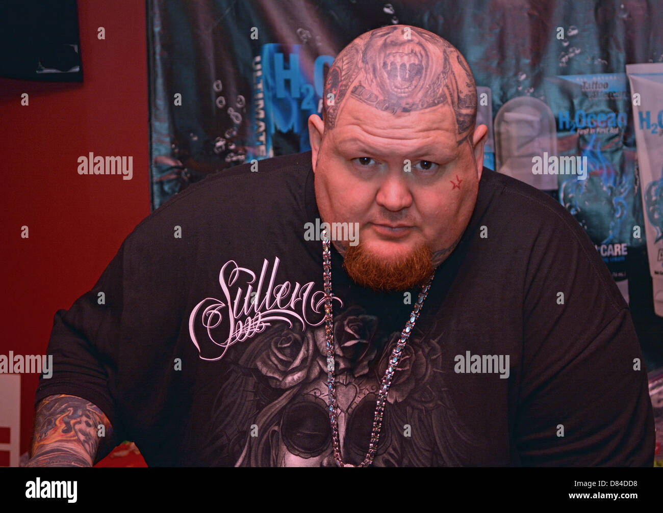 A man with multiple face and head tattoos at the 16th Annual New York City Tattoo Convention in Manhattan. Stock Photo