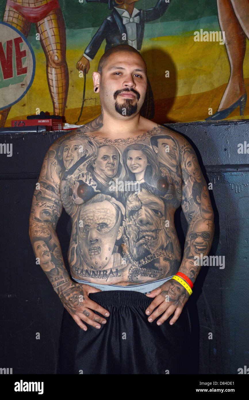 A man with multiple portrait tattoos at the New York City Tattoo Convention in Manhattan. Stock Photo