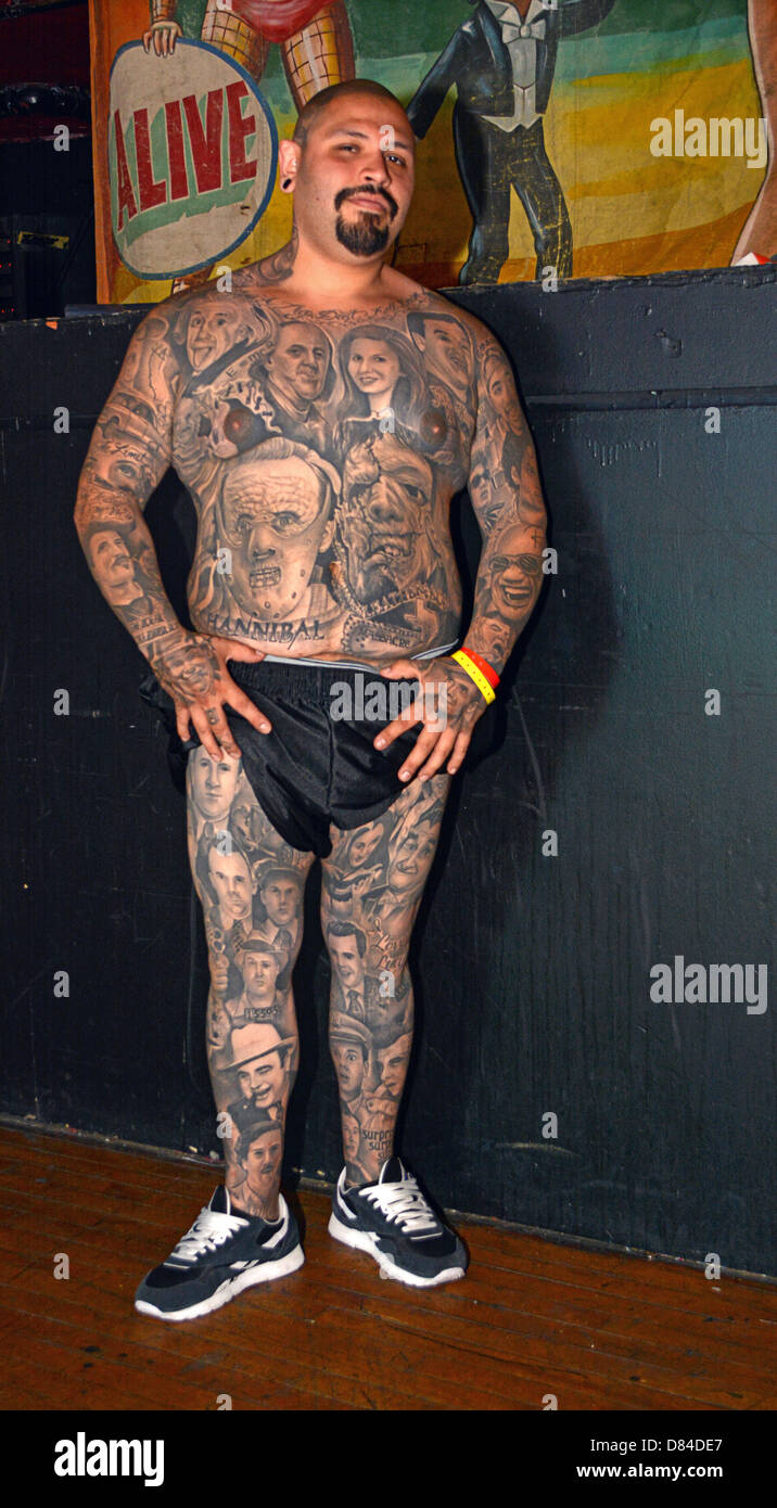 A man with multiple portrait tattoos at the New York City Tattoo Convention in Manhattan. Stock Photo