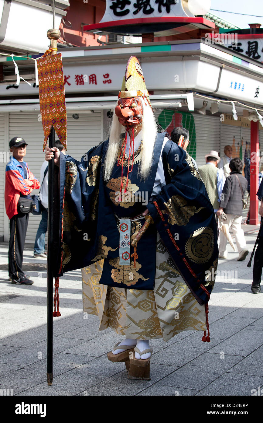 Tokyo, Japan. 19th May, 2013. A man wears a mask of Japanese longnosed