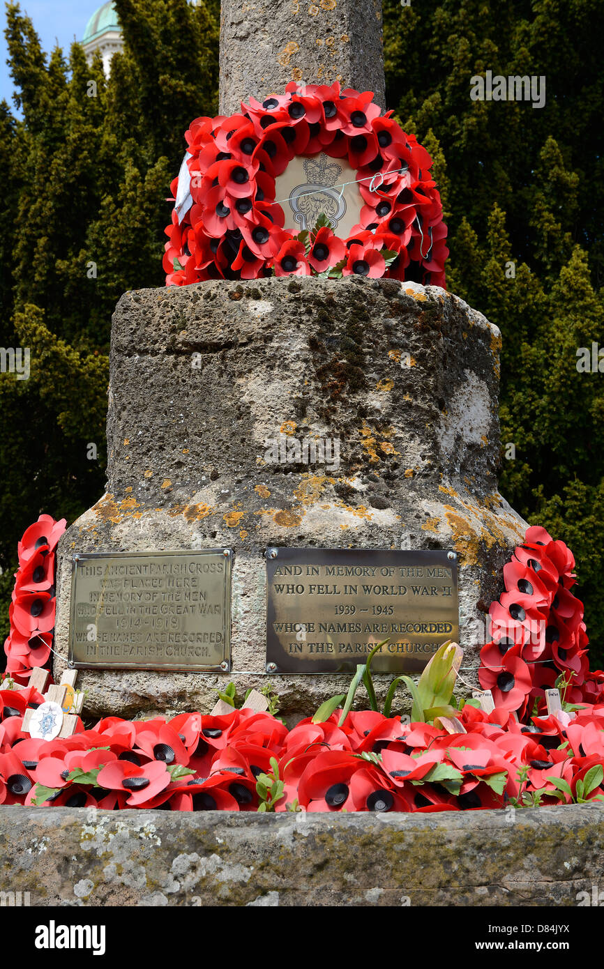 POPPY WREATHES ON AN ENGLISH TOWN WAR MEMORIAL FOR MEMBERS OF THE MILITARY KILLED IN WORLD WAR ONE AND WORLD WAR TWO. Stock Photo