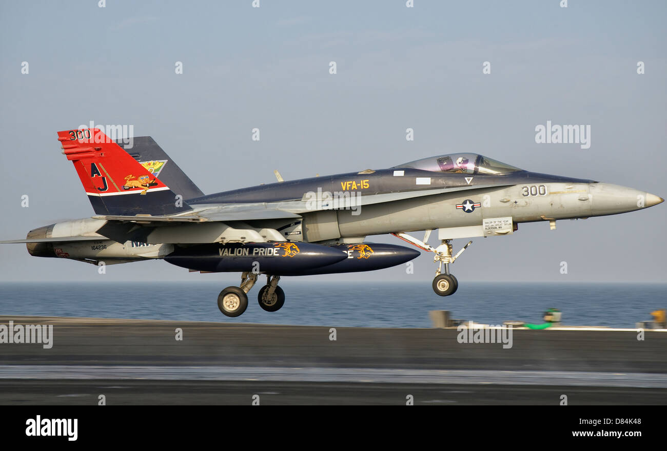 Persian Gulf, October 30, 2011 - A F/A-18C Hornet takes off from the flight deck of USS George H.W. Bush. Stock Photo