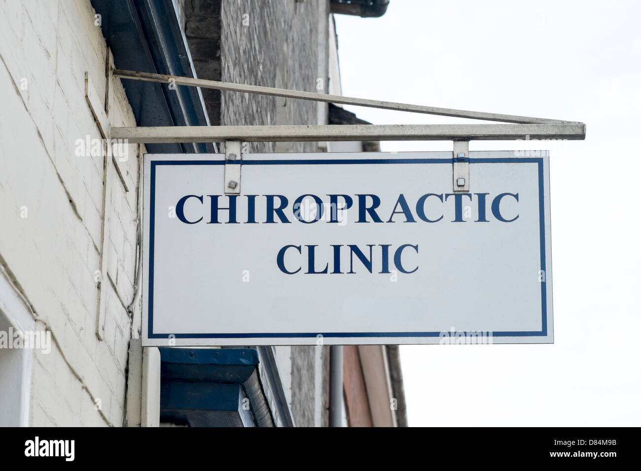 Looking up at a UK Chiropractic Clinic sign Stock Photo