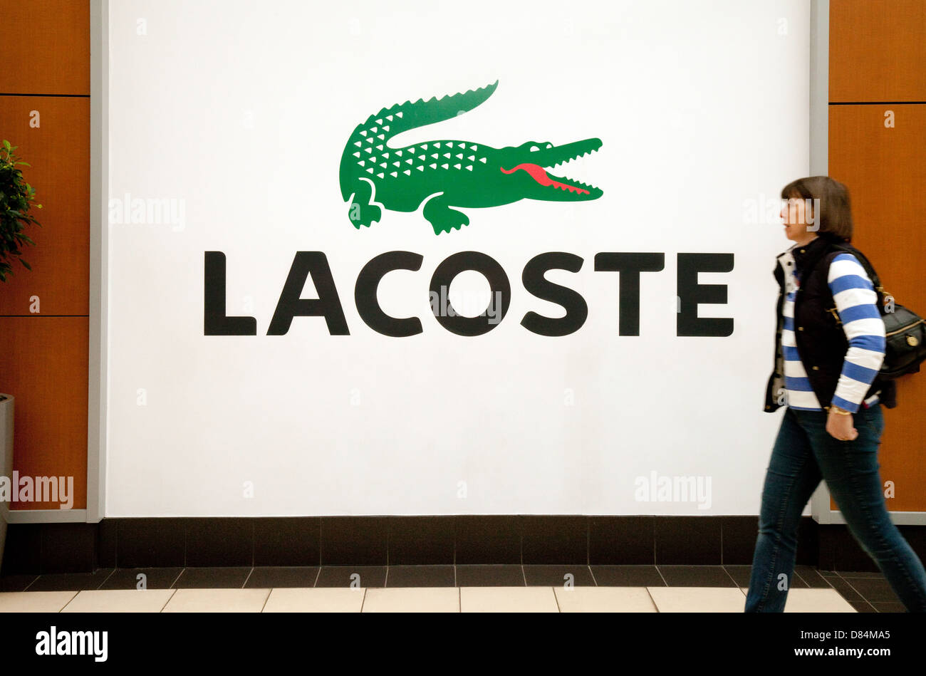 Lacoste Crocodile - the Lacoste Logo on a large sign for Lacoste fashion store shop, UK Stock Photo