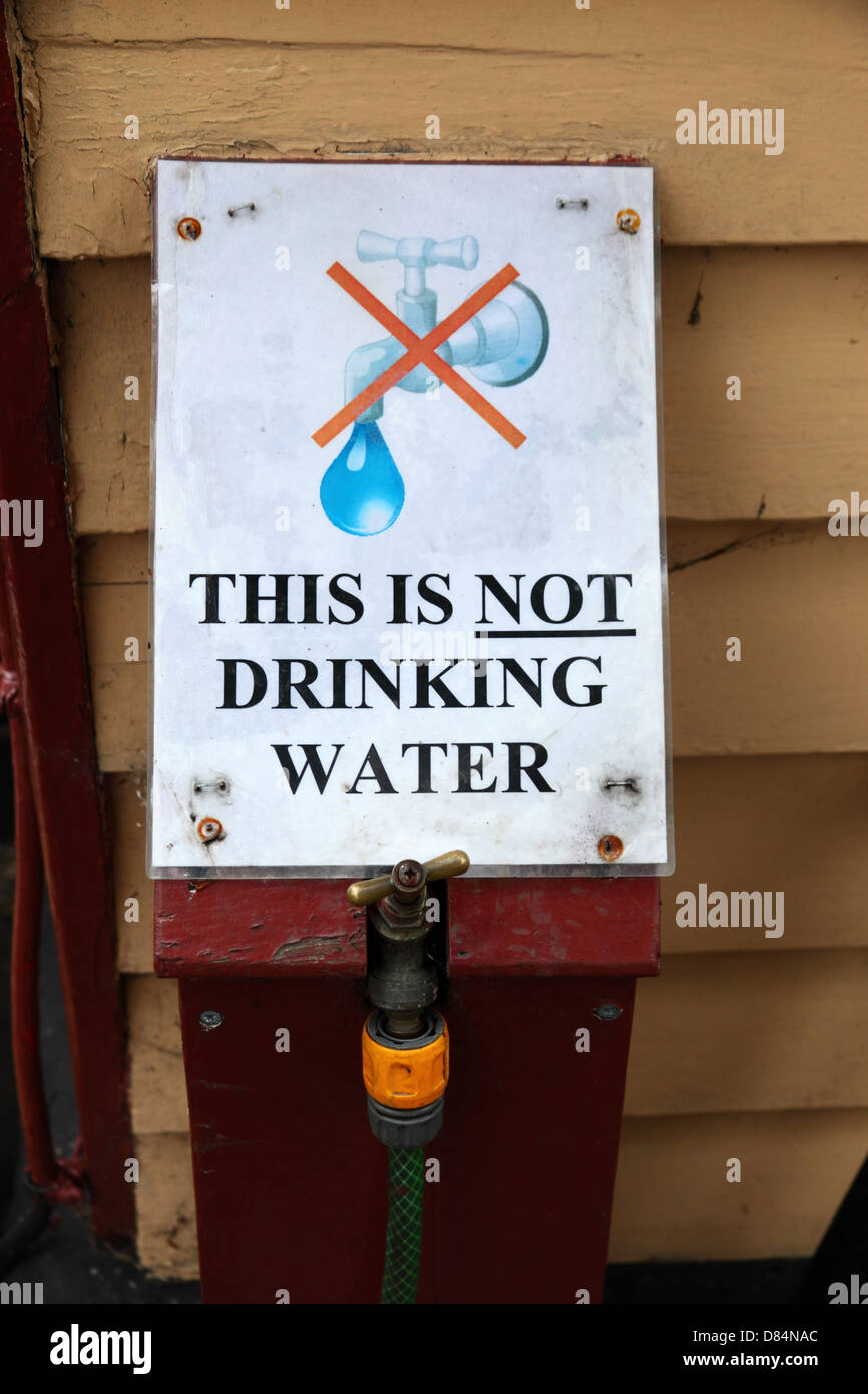 This is not drinking water sign on outside tap of railway station , Tenterden , Kent , England Stock Photo