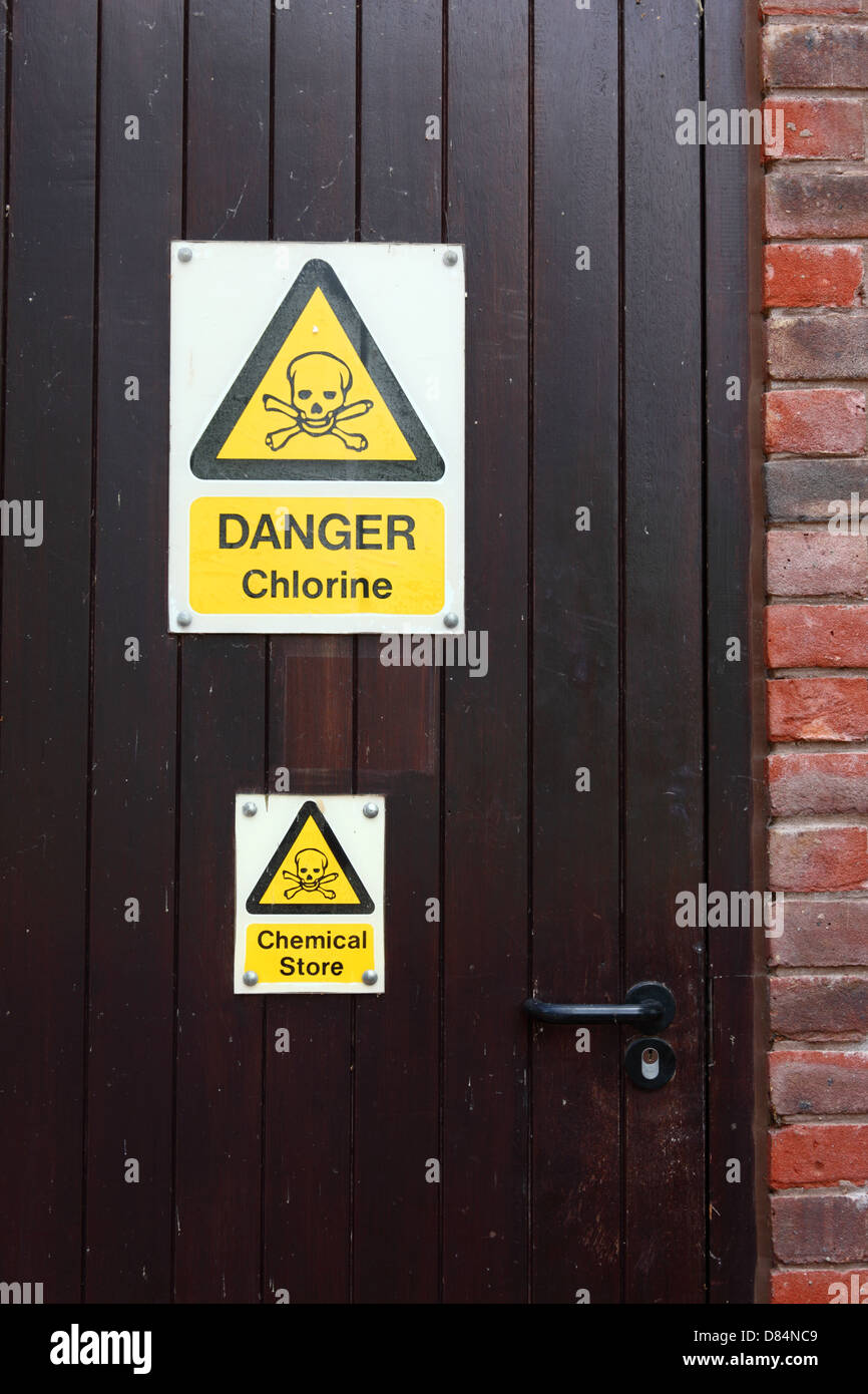 Danger Chlorine sign on door of chemical storeroom at public swimming pool, Tonbridge, Kent, England Stock Photo