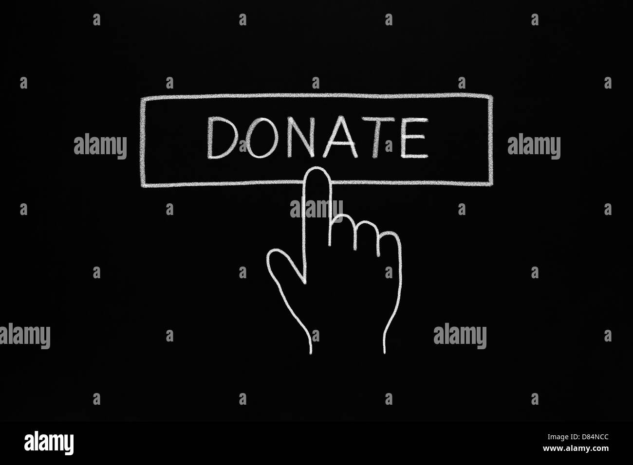 Hand clicking Donate button drawn with white chalk on blackboard Stock