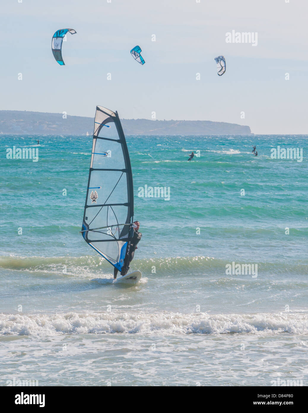 Windsurfing and kitesurfing in Can Pastilla, Majorca, a winter Sunday