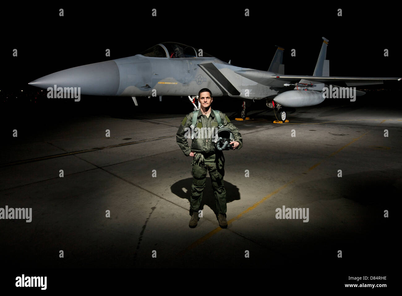 A U.S. Air Force pilot stands in front of a McDonnell Douglas F-15C aircraft. Stock Photo
