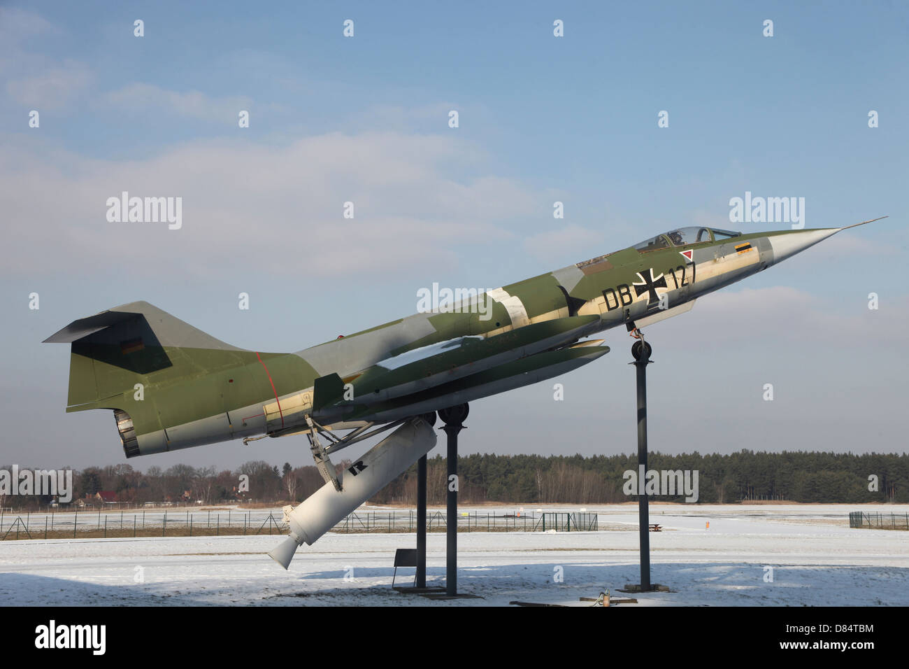 A preserved F-104G Starfighter with booster rockets pack to avoid damaged runway take-offs, Gatow Airfield, Germany. Stock Photo