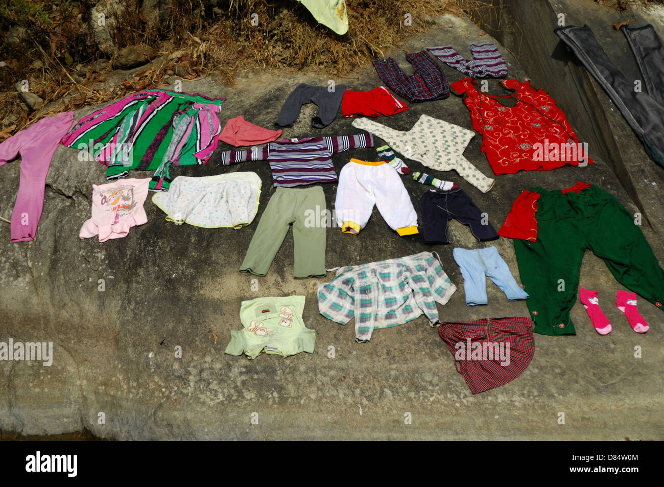 Clothes Made From Rocks wash clothes on rock Stock Photo - Alamy