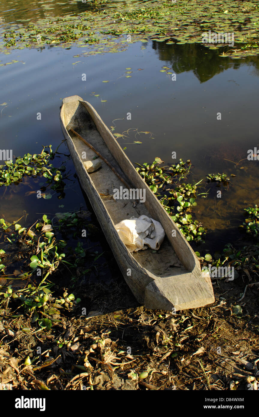 a dugout canoe on Fewa Tal lake in Phokara, Nepal. The canoe is carved