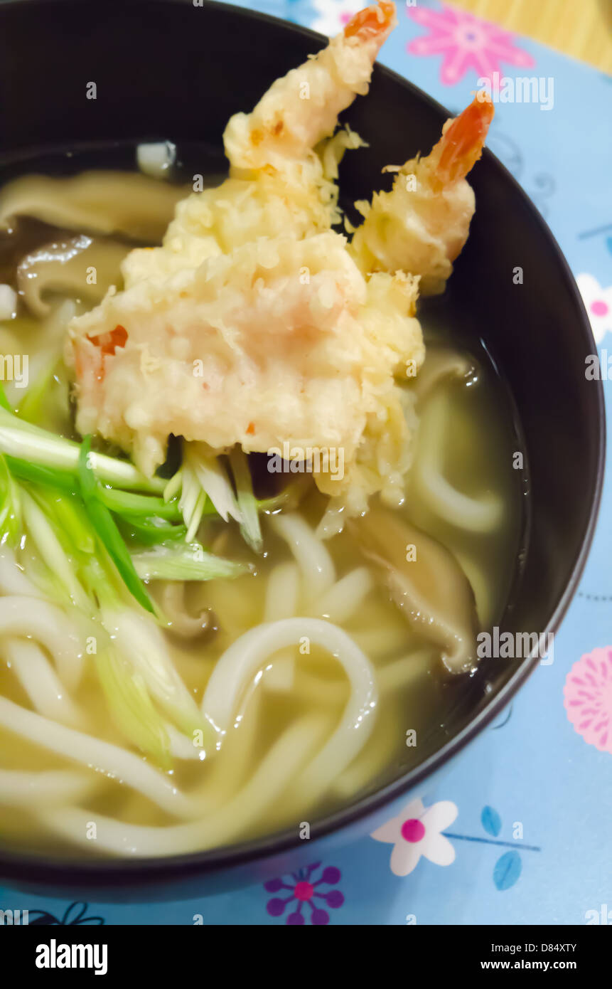 close up udon noodles with shrimp tempura in black bowl , Japanese food Stock Photo