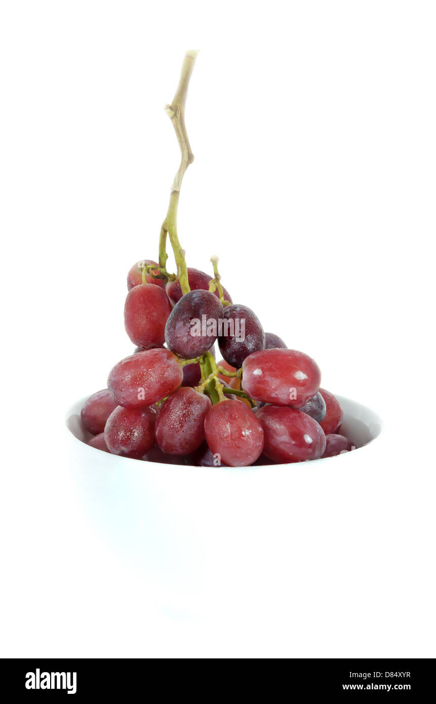 fresh grapes in white bowl on white background Stock Photo