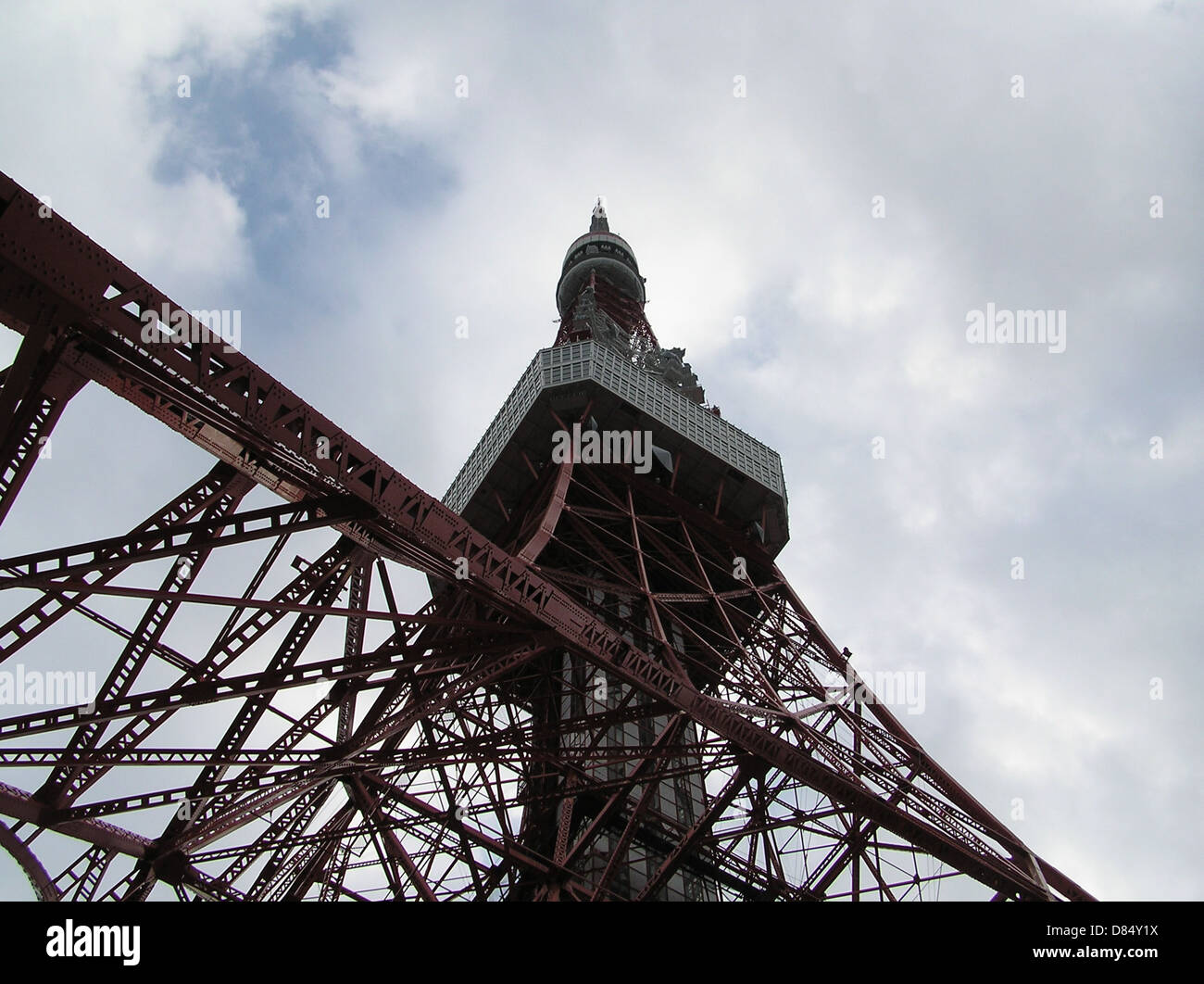 This photograph, taken on July 27, 2003, shows Tokyo Tower in Japan, a prominent landmark known for its resemblance to the Eiffel Tower. Located in Shiba Park, it is used for television broadcasting and offers great views of the city. Stock Photo
