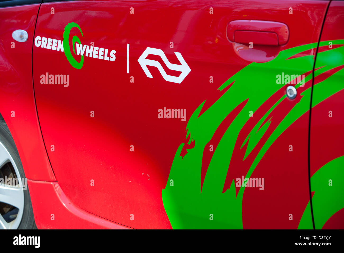 A Green wheels electric car at a charging station for electric cars in