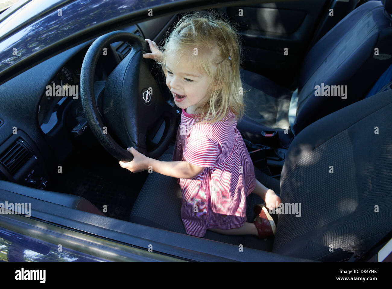 Kid driving car hires stock photography and images Alamy
