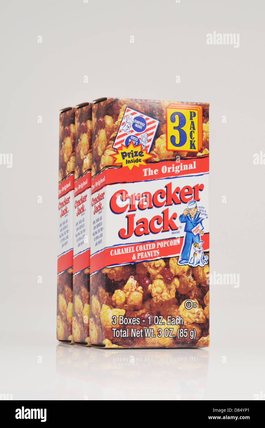 3 pack of boxes of the original caramel coated popcorn and peanuts box of Cracker Jacks on white background cutout. USA Stock Photo