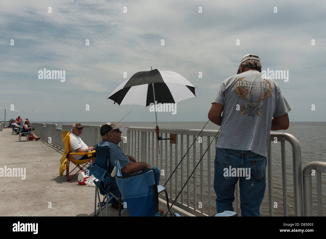 People fishing on the public pier at Cedar Key Florida on the Gulf