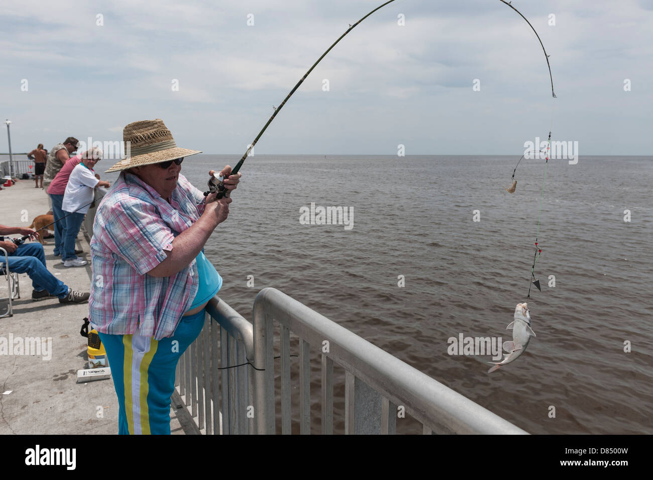 Reeling in a fish hi-res stock photography and images - Alamy