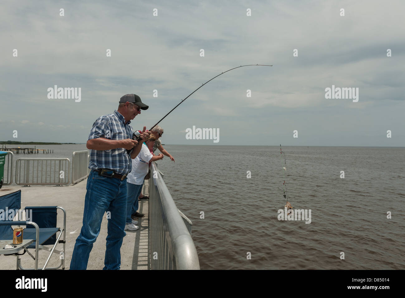 Reeling in a fish hi-res stock photography and images - Page 2 - Alamy