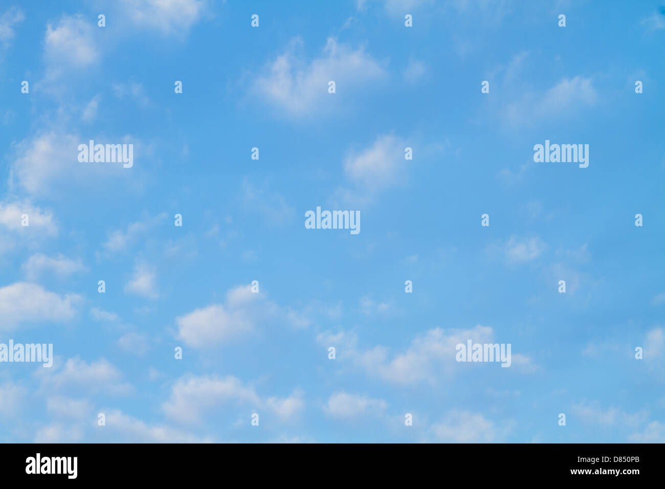 Puffy white clouds against a perfect blue sky Stock Photo - Alamy