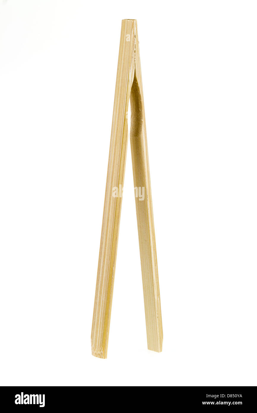 Bamboo wood tongs isolated on a white background. Stock Photo