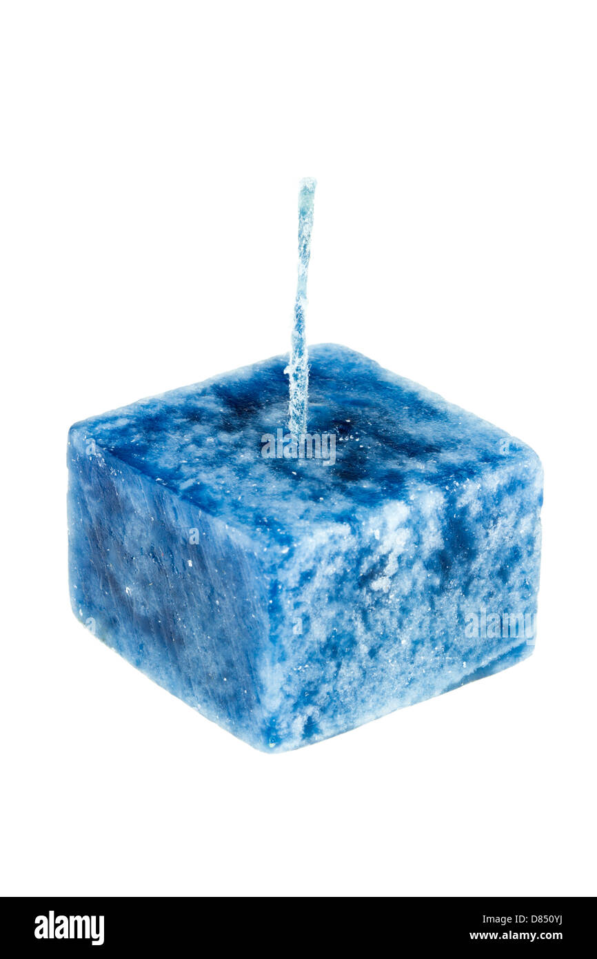 Square blue candle isolated on a white background. Stock Photo