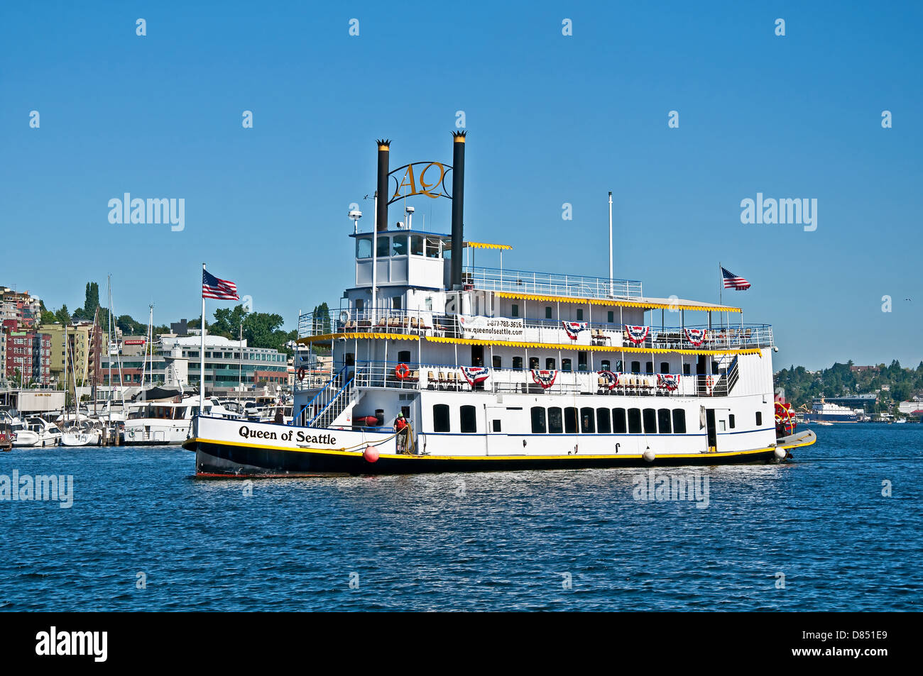 Steam powered paddle boat named Queen of Seattle, offers tours of Lake Union while teaching