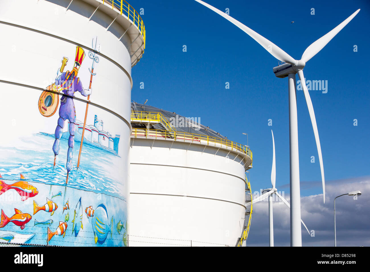 Climate Change Heaven And Hell An Oil Terminal In Amsterdam Netherlands With Wind Turbines 