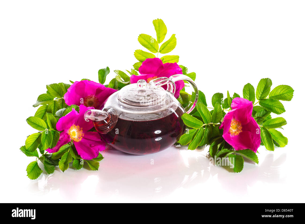 tea with rose hips on a white background Stock Photo - Alamy