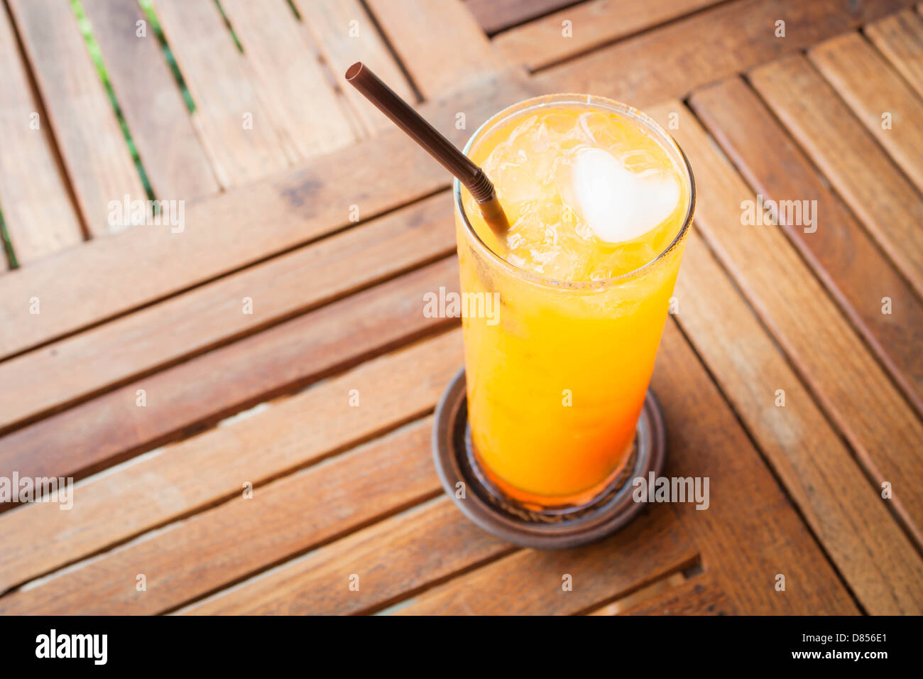 Romantic orange juice with heart ice cube Stock Photo Alamy