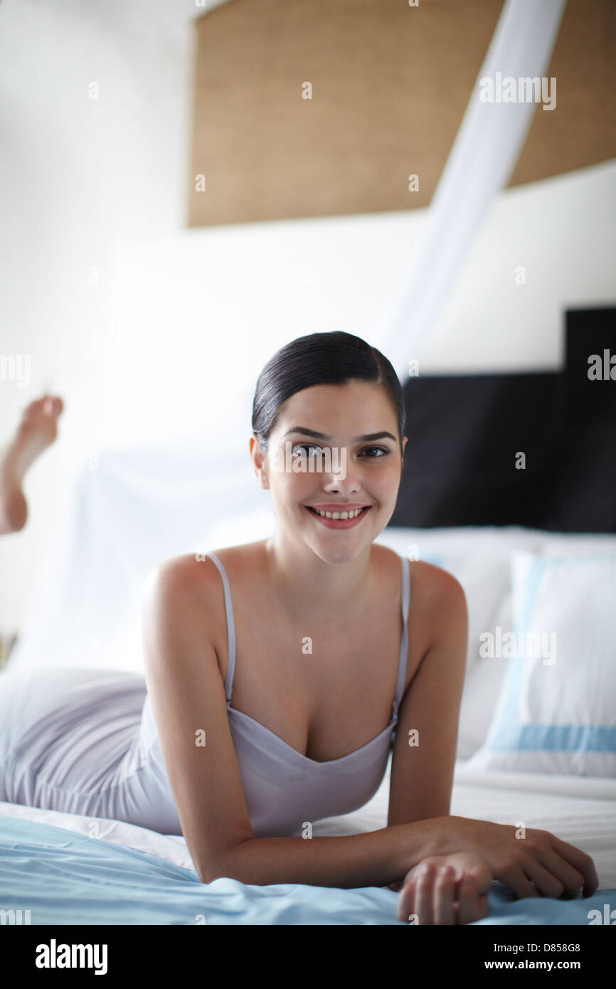 Young woman in bra lying in bed hi-res stock photography and images - Alamy