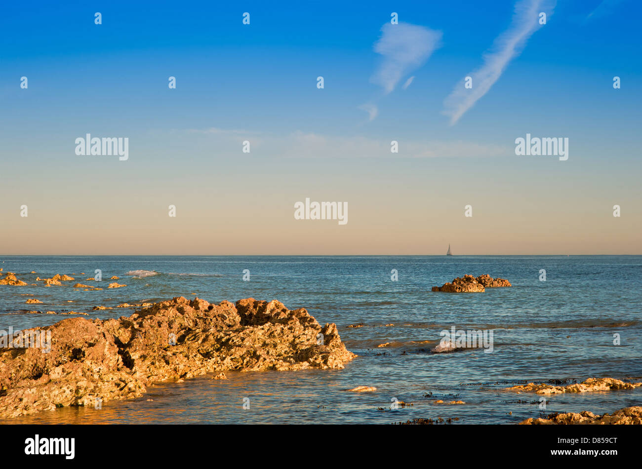 Stunning Summer sunset over ocean with rocks and vibrant colors Stock ...