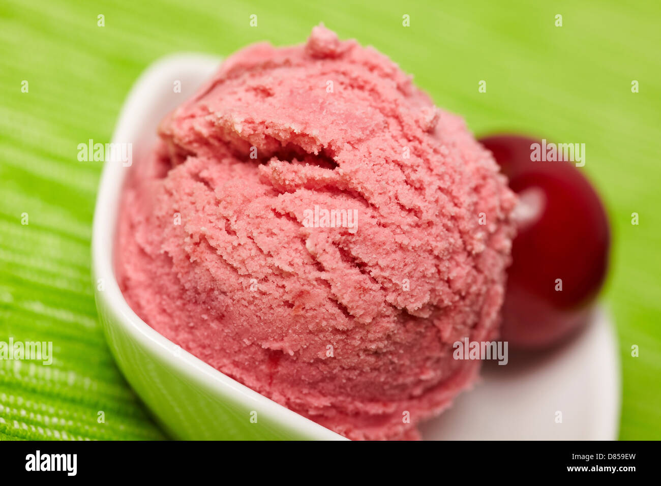Scoop of cherry ice cream in a bowl Stock Photo