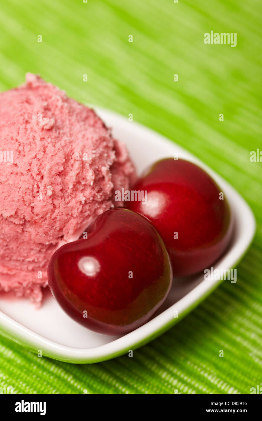 Two cherries with scoop of cherry ice cream Stock Photo