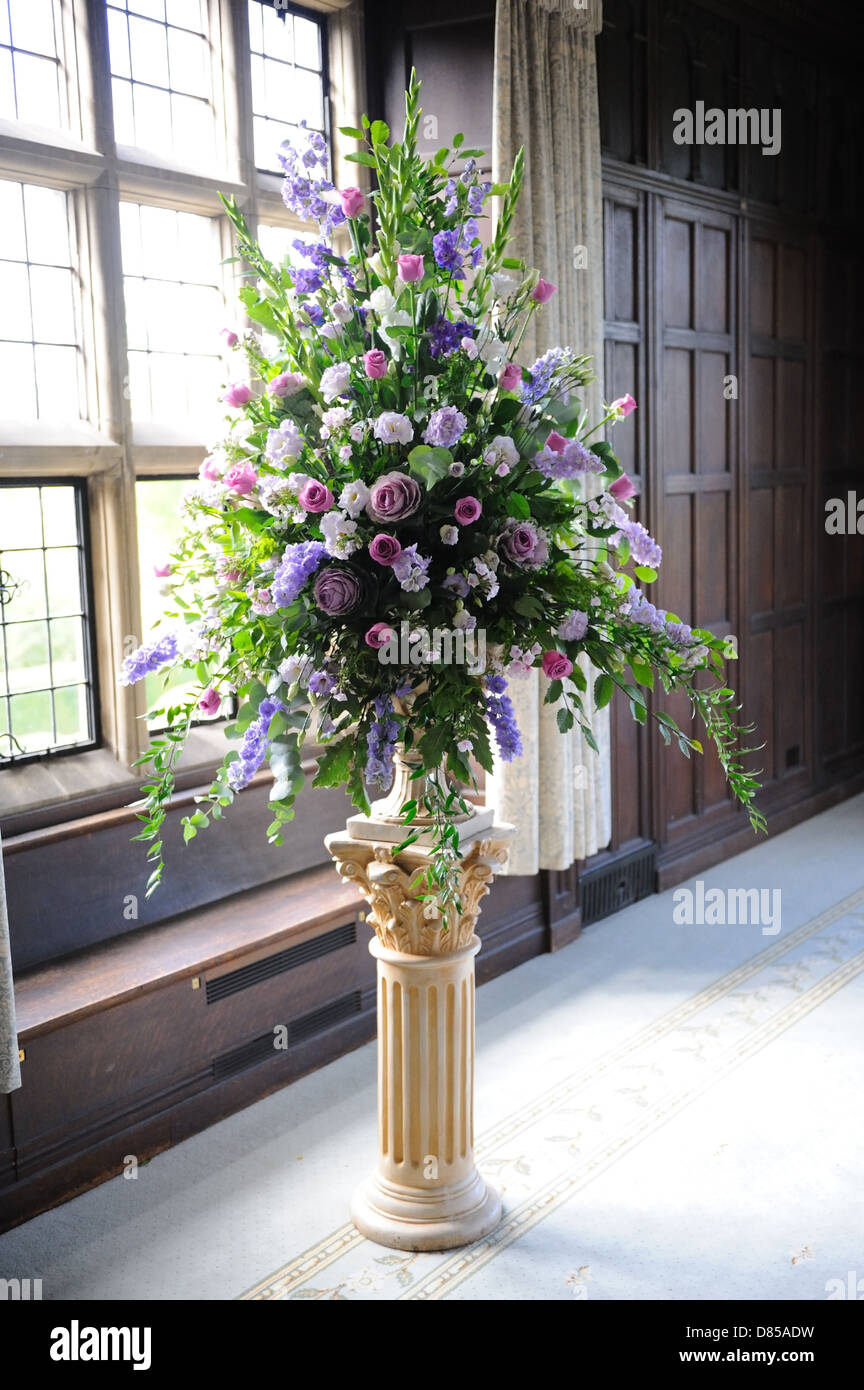 Purple flowers decorate wedding venue Stock Photo - Alamy