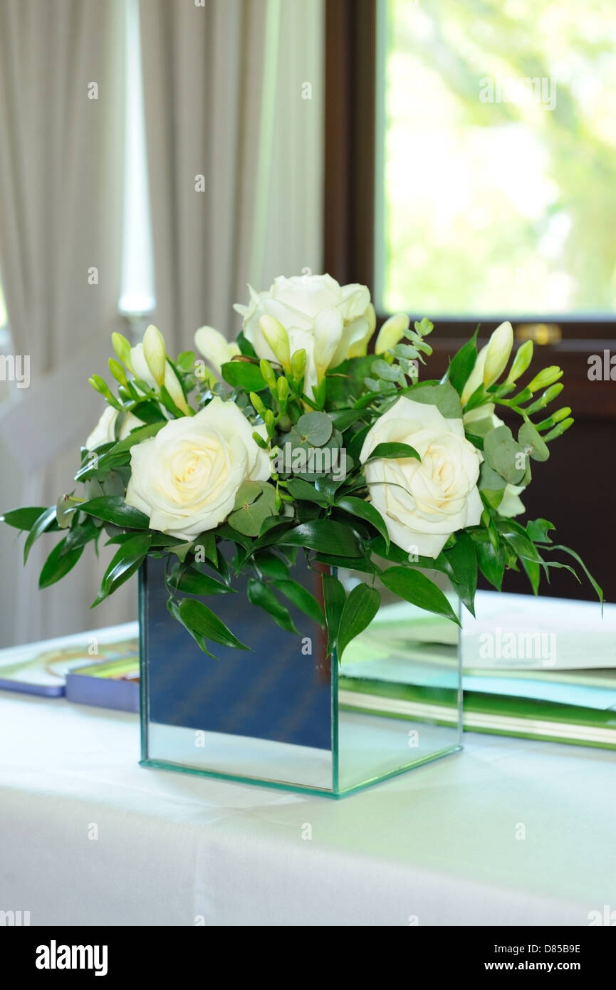 White roses decorate registration table at wedding Stock Photo